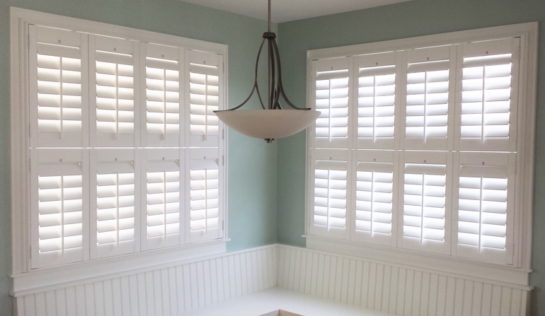 Soft green wall in Salt Lake City kitchen with shutters.